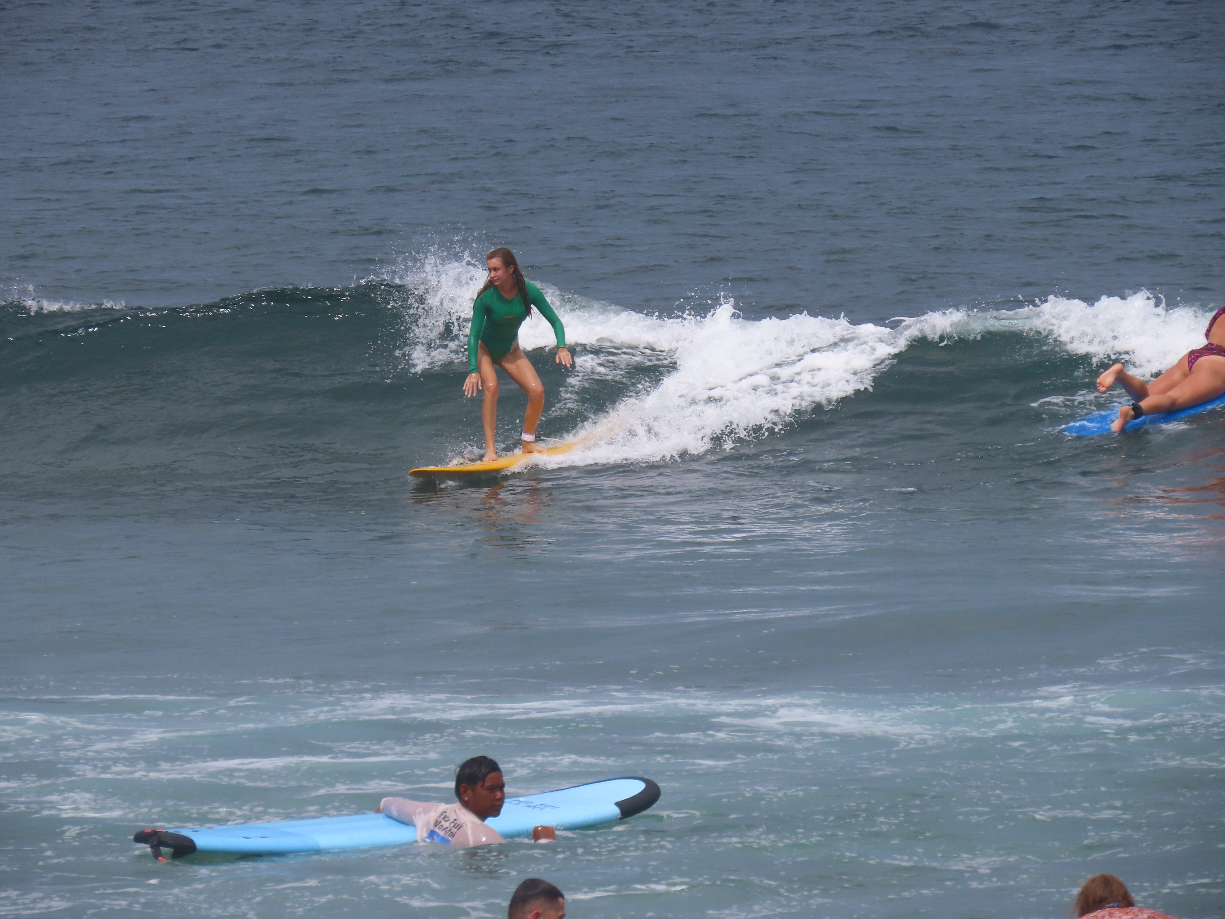 Surfer being filmed during a lesson for video analysis